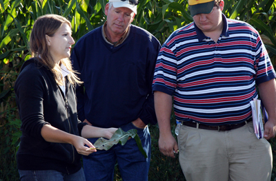 Kiersten showing diseased leaf at the Diagnostic Training Center